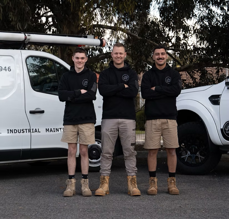 Josh and the JRV Electrical team in front of their work vans